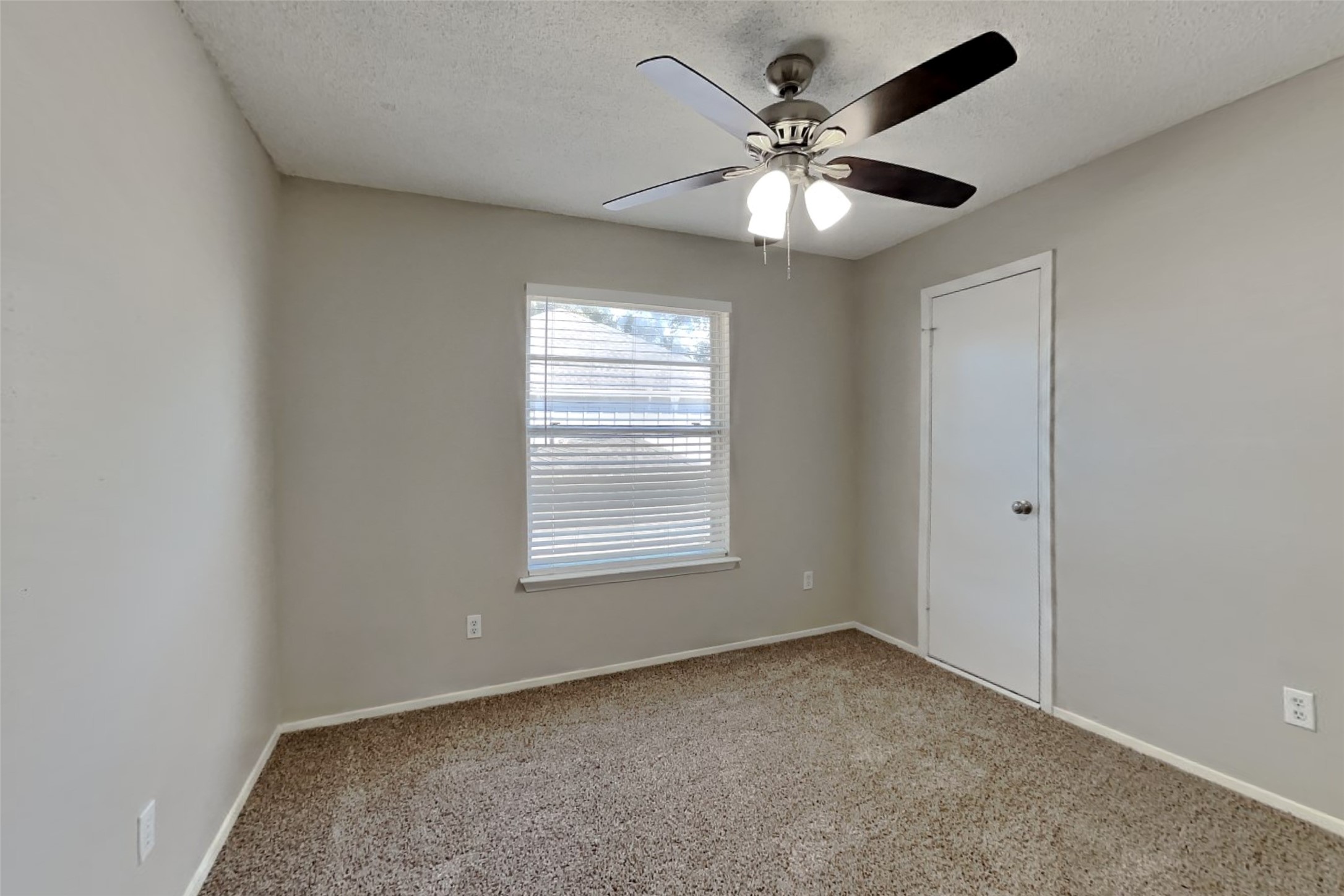10018 Rippling Fields Drive Houston, TX 77064 - Photo 12 of 21 a view of an empty room with a window