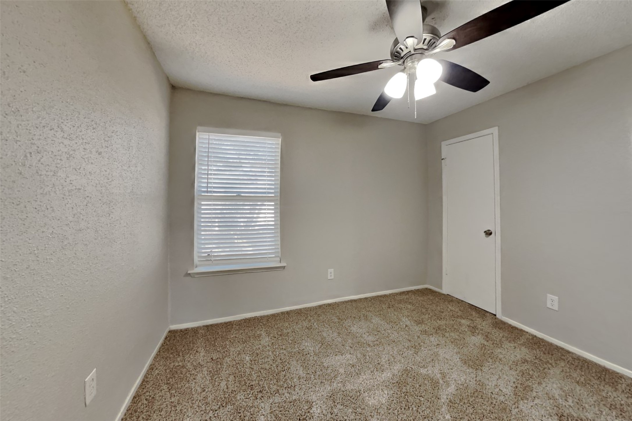10018 Rippling Fields Drive Houston, TX 77064 - Photo 13 of 21 a view of an empty room with a window