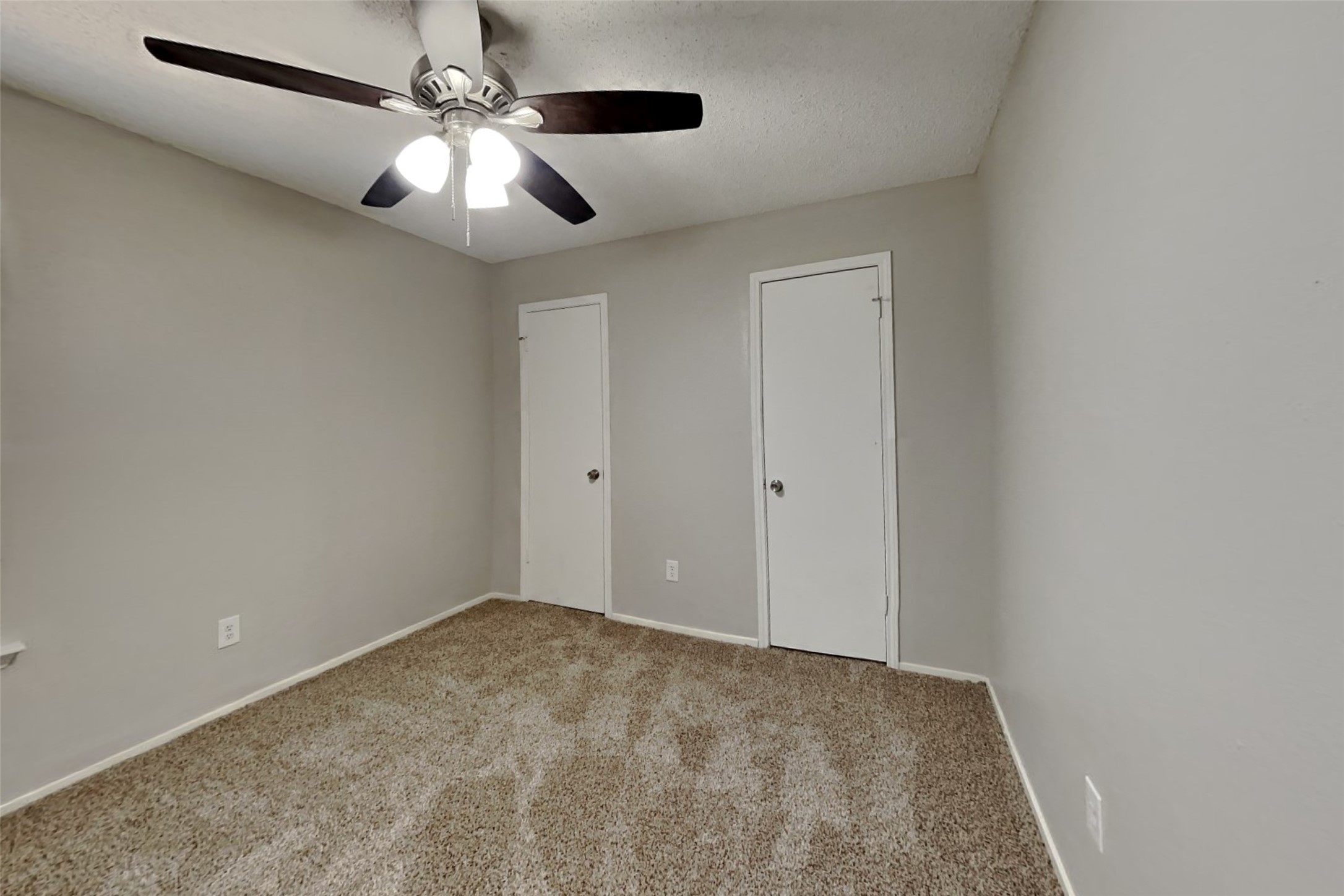 10018 Rippling Fields Drive Houston, TX 77064 - Photo 14 of 21 an empty room with chandelier fan