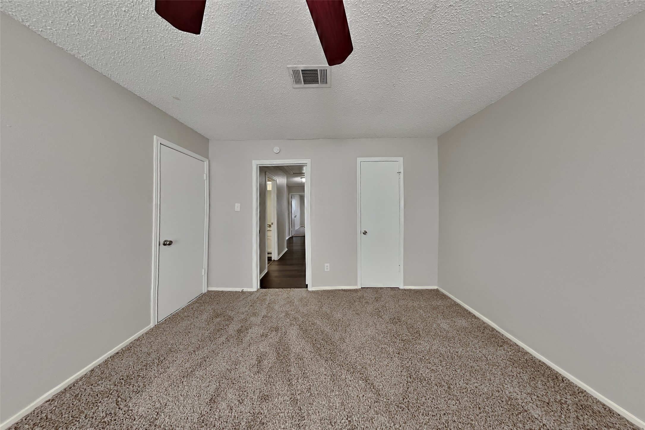 10018 Rippling Fields Drive Houston, TX 77064 - Photo 15 of 21 a view of a room has a ceiling fan and window