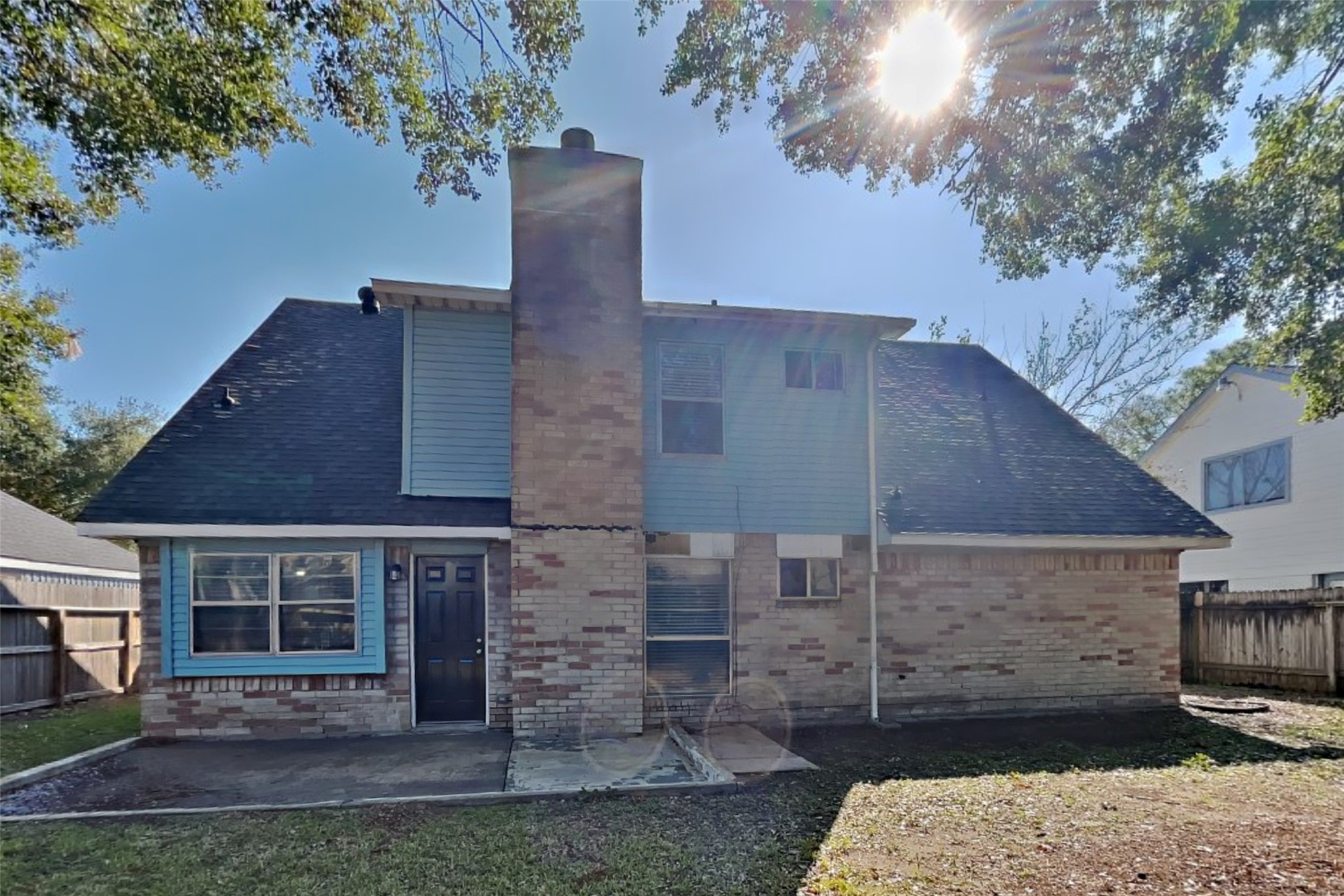 10018 Rippling Fields Drive Houston, TX 77064 - Photo 19 of 21 a brick building with a yard and potted plants