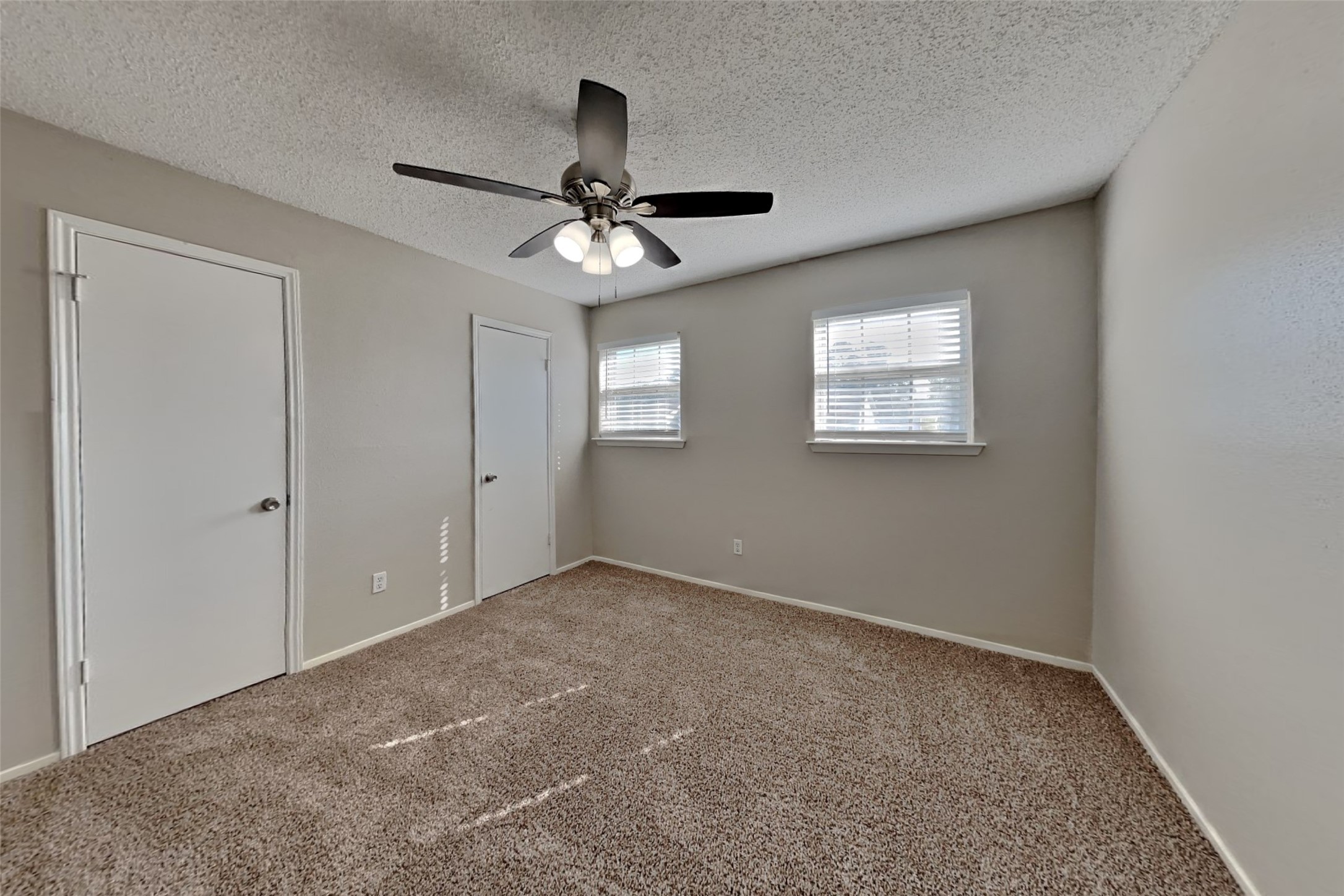 10018 Rippling Fields Drive Houston, TX 77064 - Photo 10 of 21 a view of room with a ceiling fan and window