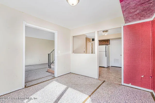 a kitchen with stainless steel appliances granite countertop a stove a refrigerator and a cabinets