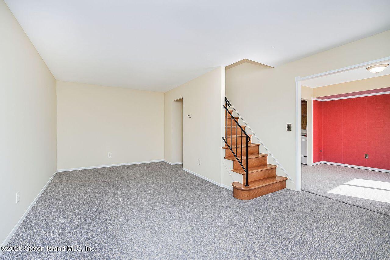 15 Parkview Loop Staten Island, NY 10314 - Photo 2 of 25 a view of an empty room with stairs