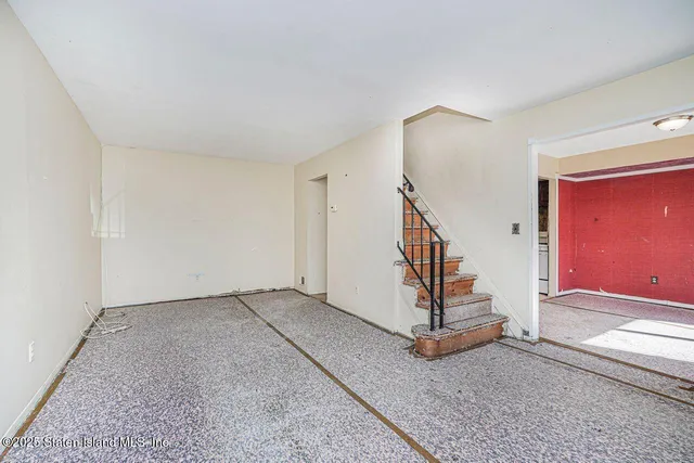 a view of a hallway with staircase