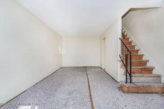 a view of entryway with stairs