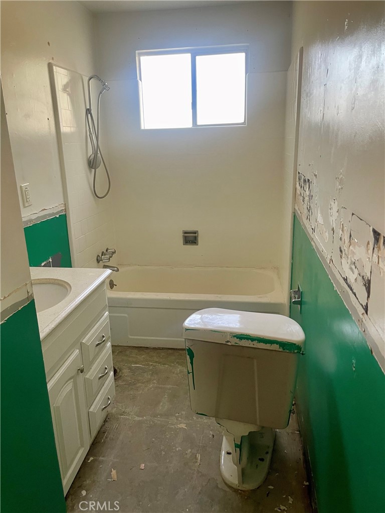 2441 Madrone Street Sutter, CA 95982 - Photo 15 of 45 a bathroom with a toilet sink and mirror