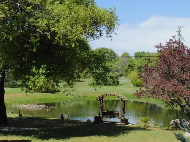 a kitchen with stainless steel appliances granite countertop a stove and cabinets