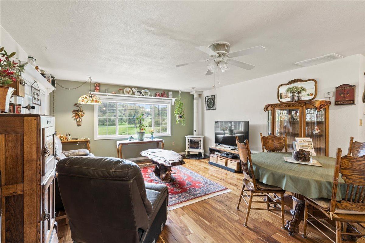 5383 Dream Ranch Circle Placerville, CA 95667 - Photo 25 of 91 a living room with furniture a fireplace and a flat screen tv
