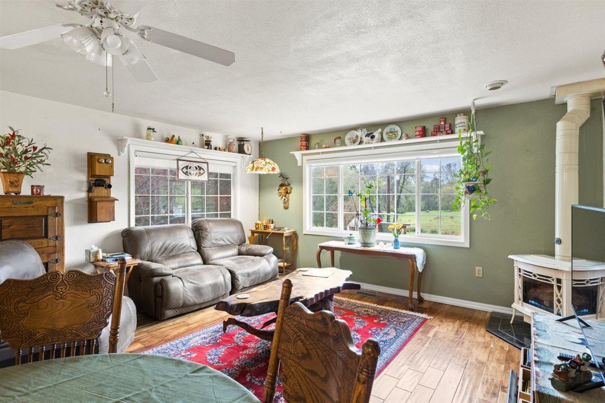 5383 Dream Ranch Circle Placerville, CA 95667 - Photo 26 of 91 a bedroom with a bed wooden floor and a large window