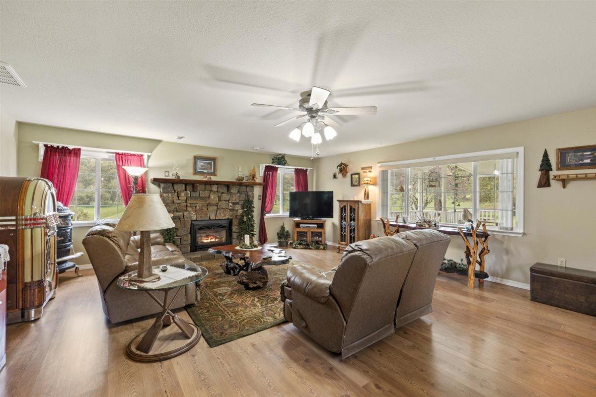 5383 Dream Ranch Circle Placerville, CA 95667 - Photo 31 of 91 a living room with fireplace furniture and a flat screen tv