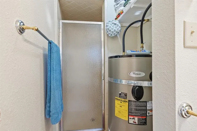 a view of a swimming pool and trees in the background