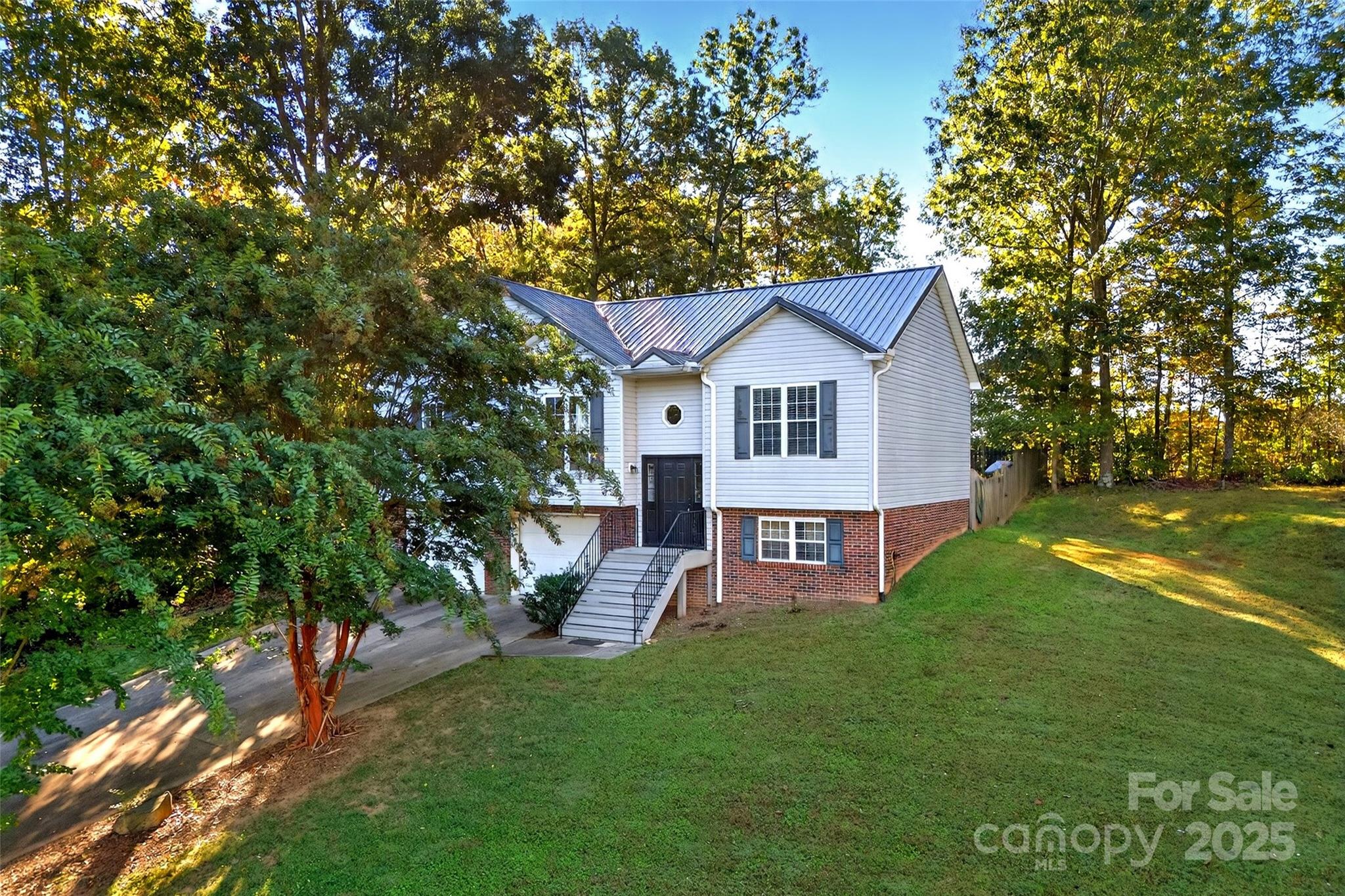 2691 Laurel Point Drive Nebo, NC 28761 - Photo 40 of 44 a view of a house with a yard porch and sitting area