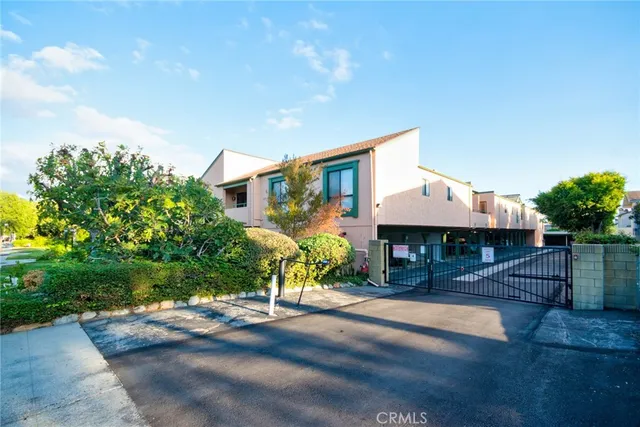 a front view of a house with a yard and a garage