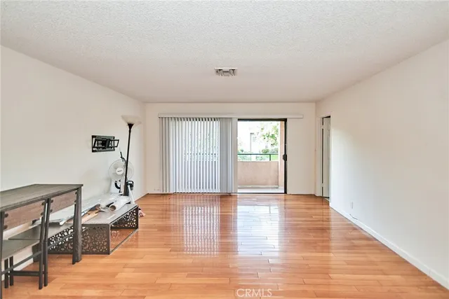 a view of livingroom with hardwood floor and a window