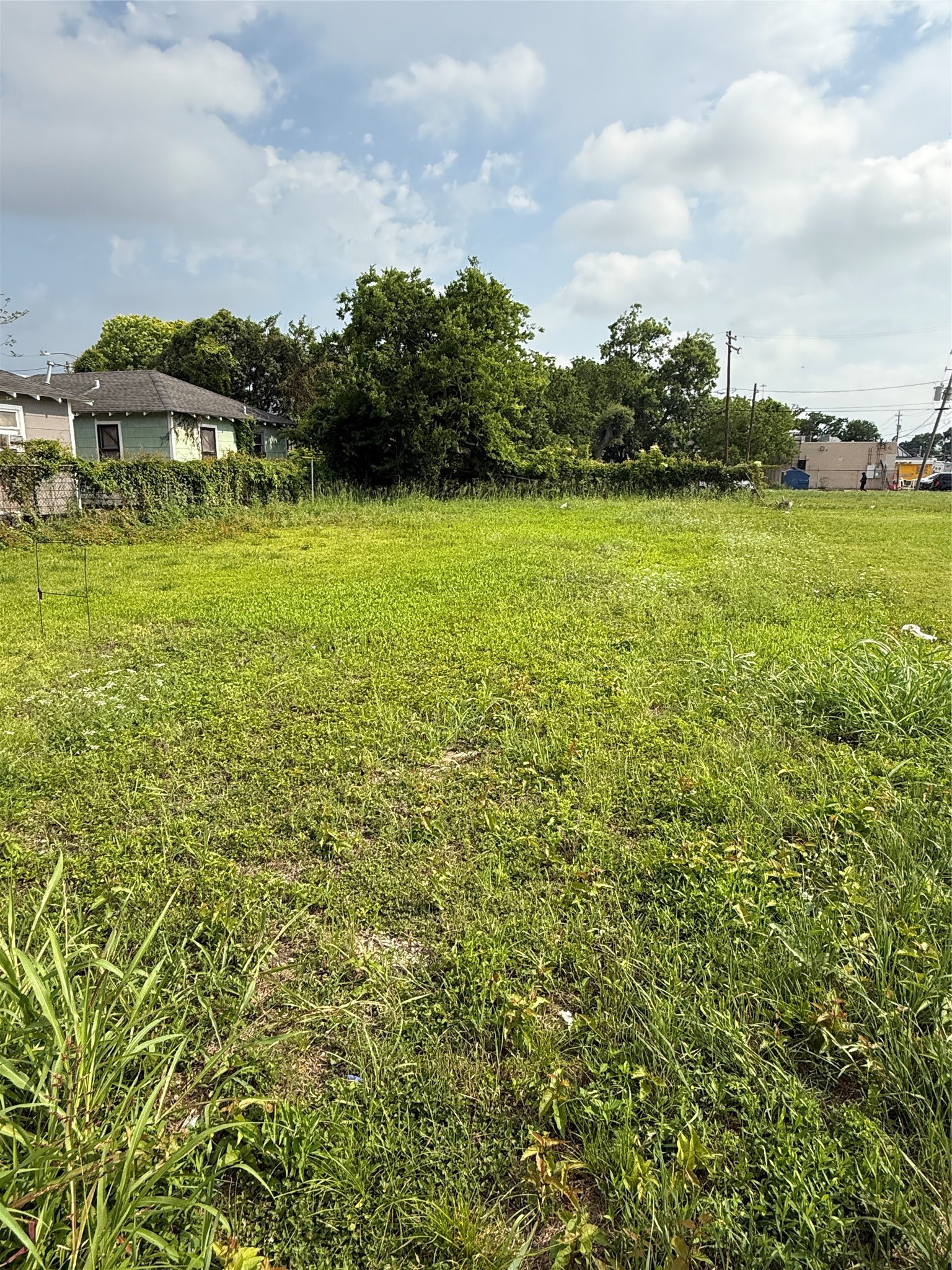 3457 Tuam Street Houston, TX 77004 - Photo 1 of 4 a view of a lake with houses in the background