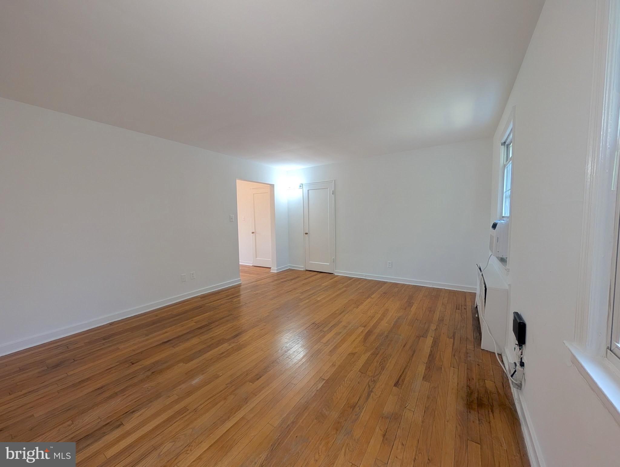 2406 Colston Drive, Unit 302 Silver Spring, MD 20910 - Photo 7 of 21 a view of empty room with wooden floor