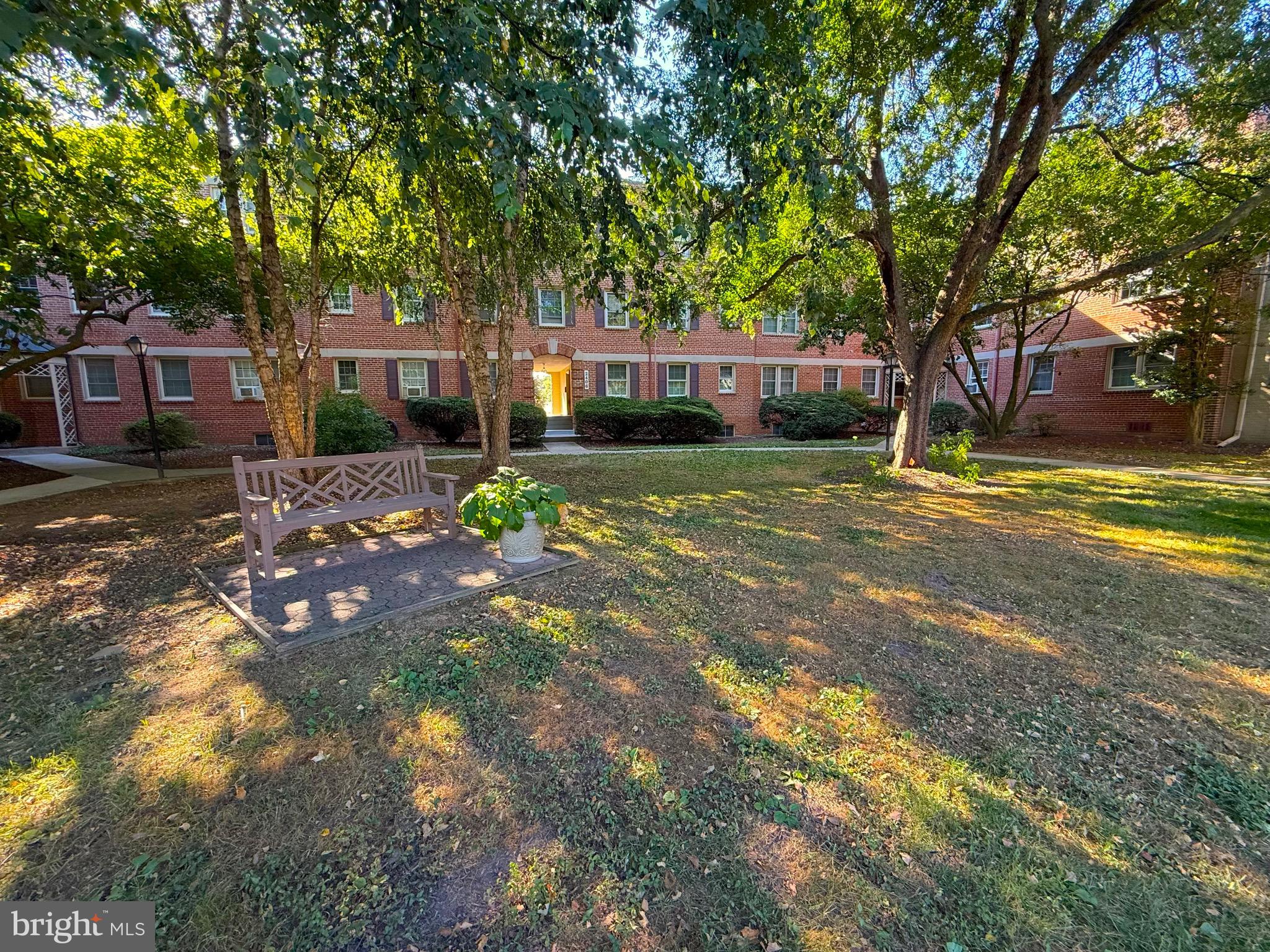 2406 Colston Drive, Unit 302 Silver Spring, MD 20910 - Photo 10 of 21 a front view of a house with a garden