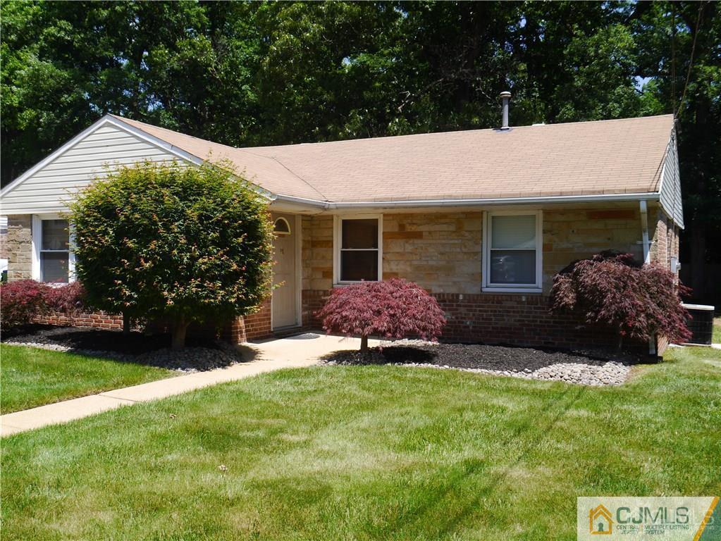 3 Melville Road Edison, NJ 08817 - Photo 1 of 20 a backyard of a house with potted plants and large tree