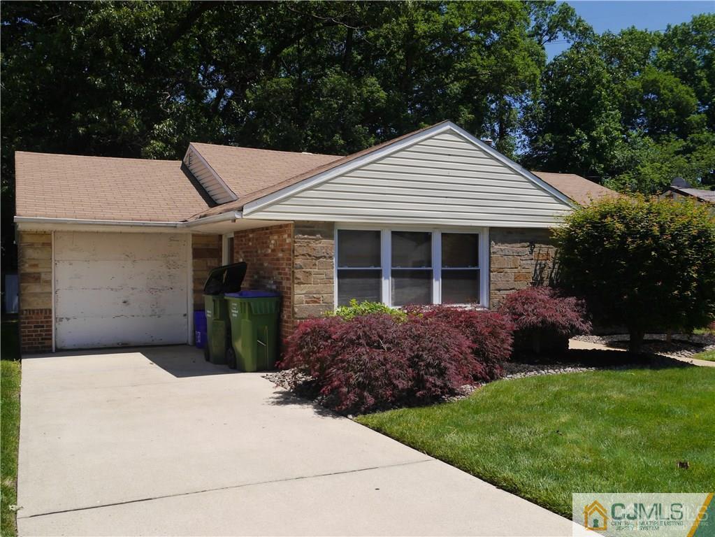 3 Melville Road Edison, NJ 08817 - Photo 2 of 20 a front view of a house with a garden and plants