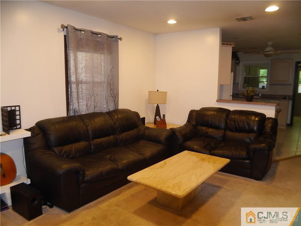 3 Melville Road Edison, NJ 08817 - Photo 4 of 20 a living room with furniture and a couch