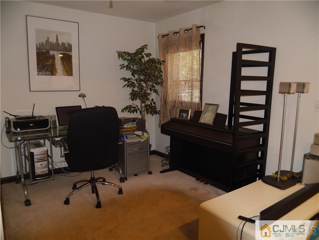 3 Melville Road Edison, NJ 08817 - Photo 5 of 20 a view of a workspace with furniture and a window