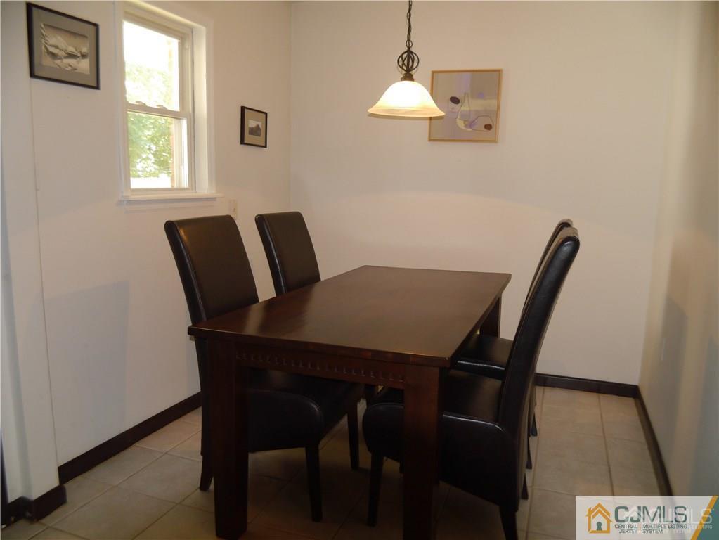 3 Melville Road Edison, NJ 08817 - Photo 8 of 20 a view of a dining room with furniture and a window