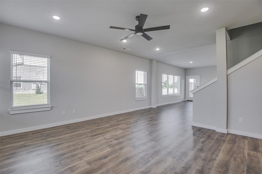 4062 Clovis Street Midlothian, TX 76065 - Photo 2 of 19 a view of an empty room with a window and wooden floor