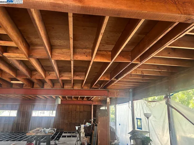 a view of room with wooden floor