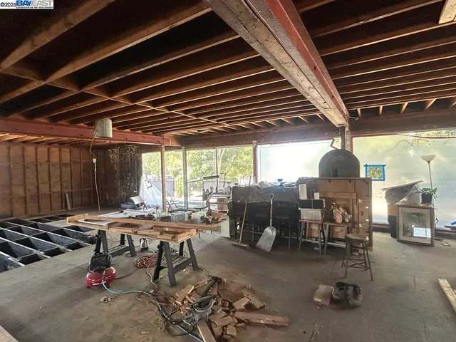 a patio with table and chairs