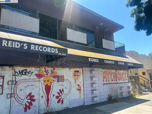 a view of a shop in a street