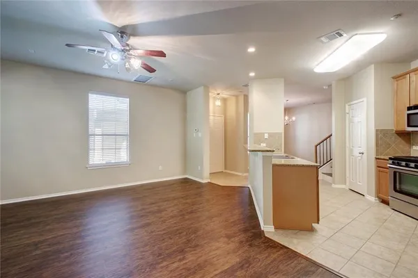 a kitchen with stainless steel appliances a refrigerator and a sink