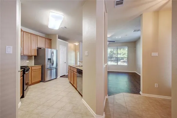 a kitchen with a sink stove and refrigerator