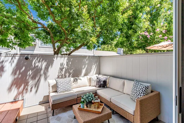 a outdoor living space with furniture and a potted plant