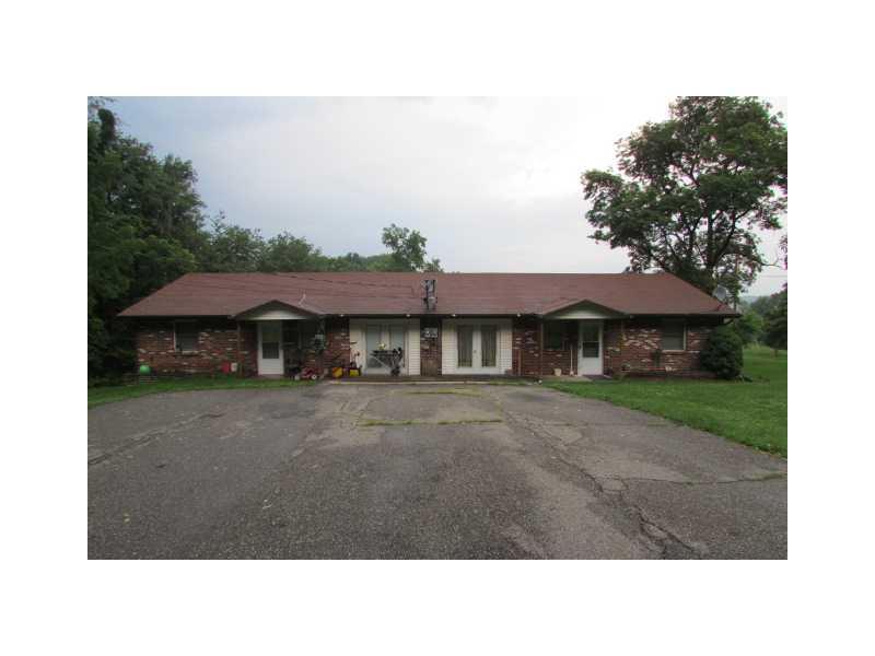 185 South Kings Creek Road Burgettstown, PA 15021 - Photo 1 of 9 Exterior Front. BRICK BLDG. 2 UNITS, RANCH STYLE. THE DOUBLE DOORS WERE SINGLE CAR GARAGES COULD BE RETURNED TO GARAGES. THEY ARE USED NOW FOR STORAGE,DINING ROOM OR 3RD BEDROOM.