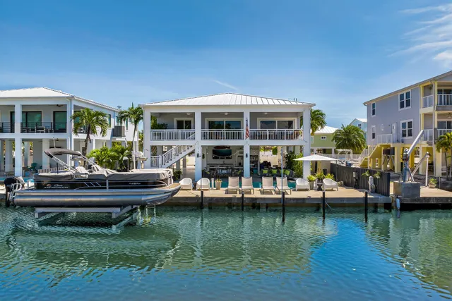 a room with lots of furniture and a chandelier