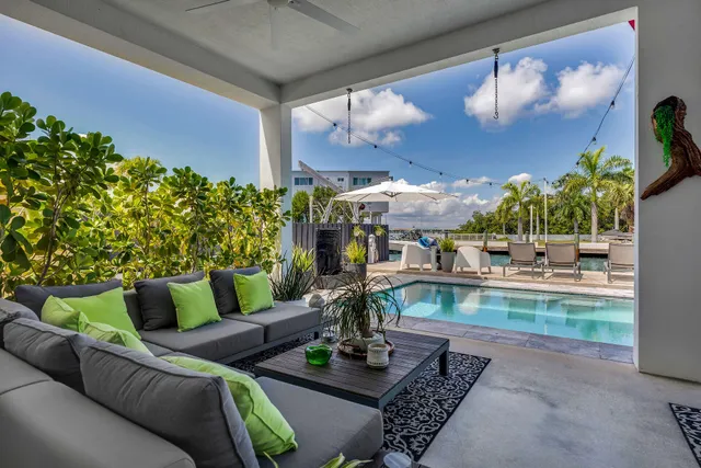 a view of kitchen with stainless steel appliances granite countertop a stove and a refrigerator