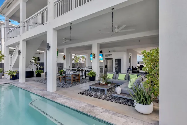 a kitchen with a sink and living room