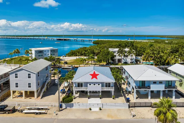 an aerial view of a houses with outdoor space
