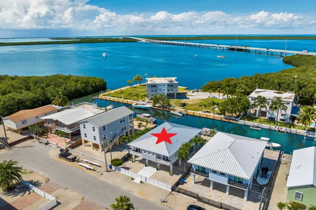 an aerial view of a houses with outdoor space