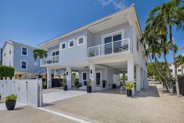 a living room filled with furniture and floor to ceiling window