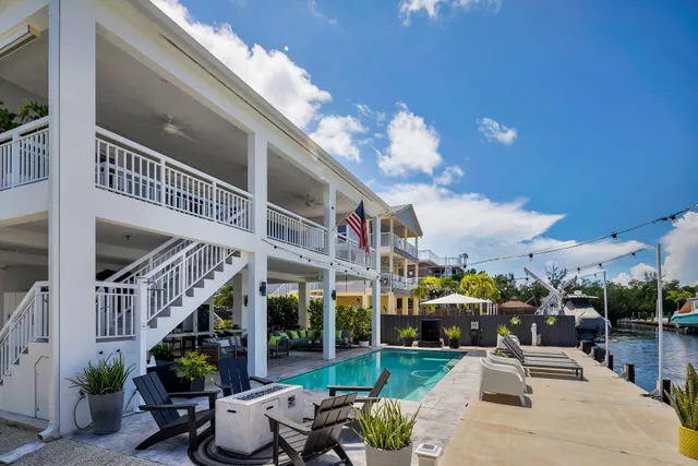 a view of a dining room with furniture and a potted plant