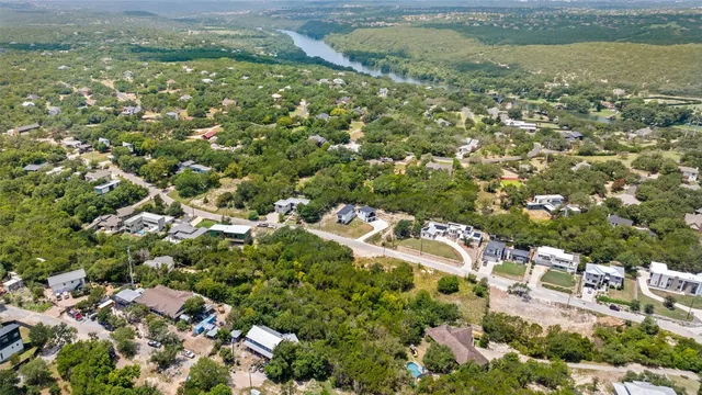 an aerial view of residential houses with outdoor space