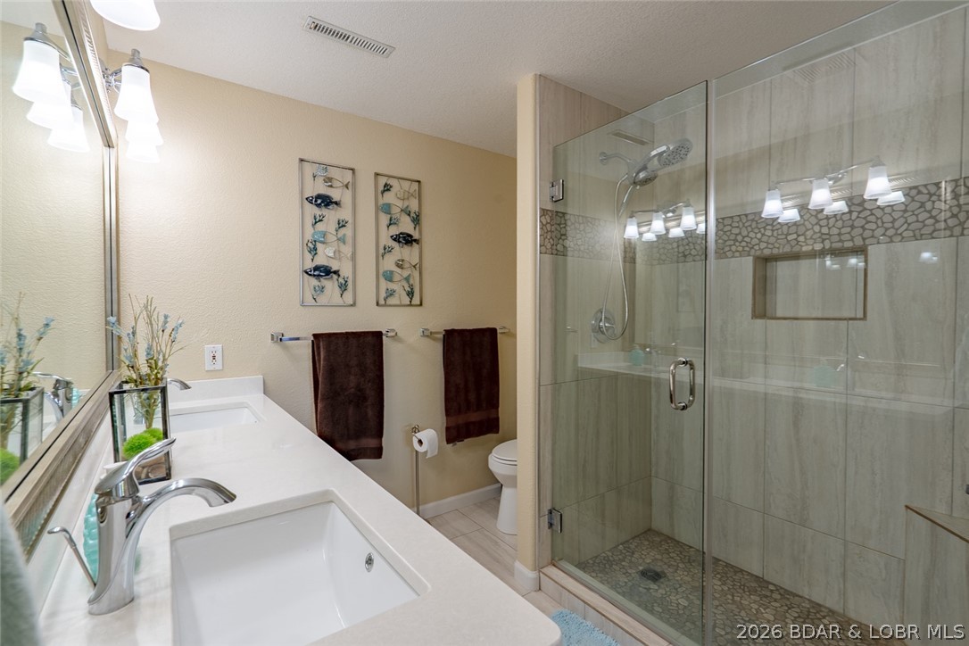 150 Cub Cove Point Camdenton, MO 65020 - Photo 52 of 89 Gorgeous tiled shower and dual vanity