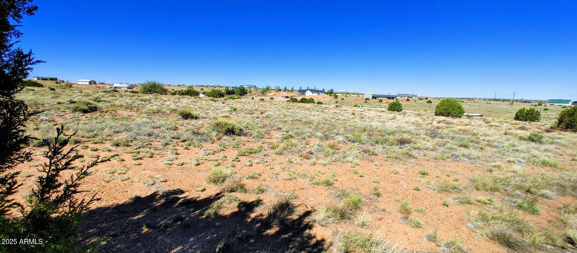 1190 Haystack Road, Unit 68 Taylor, AZ 85939 - Photo 2 of 7 a view of a large building with mountains in the background