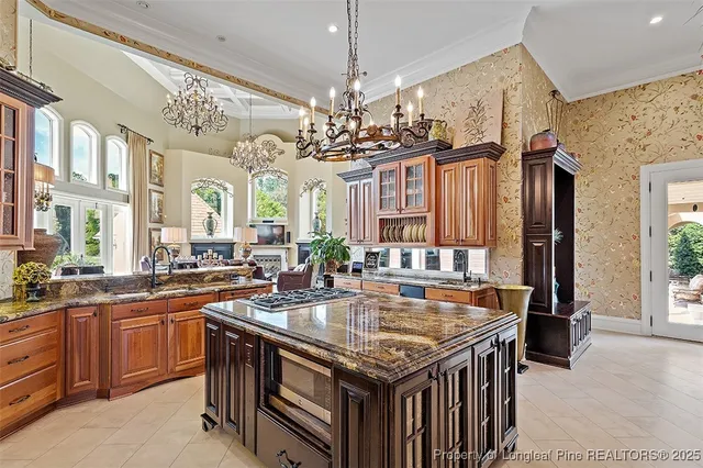 a kitchen with a stove a sink and a refrigerator