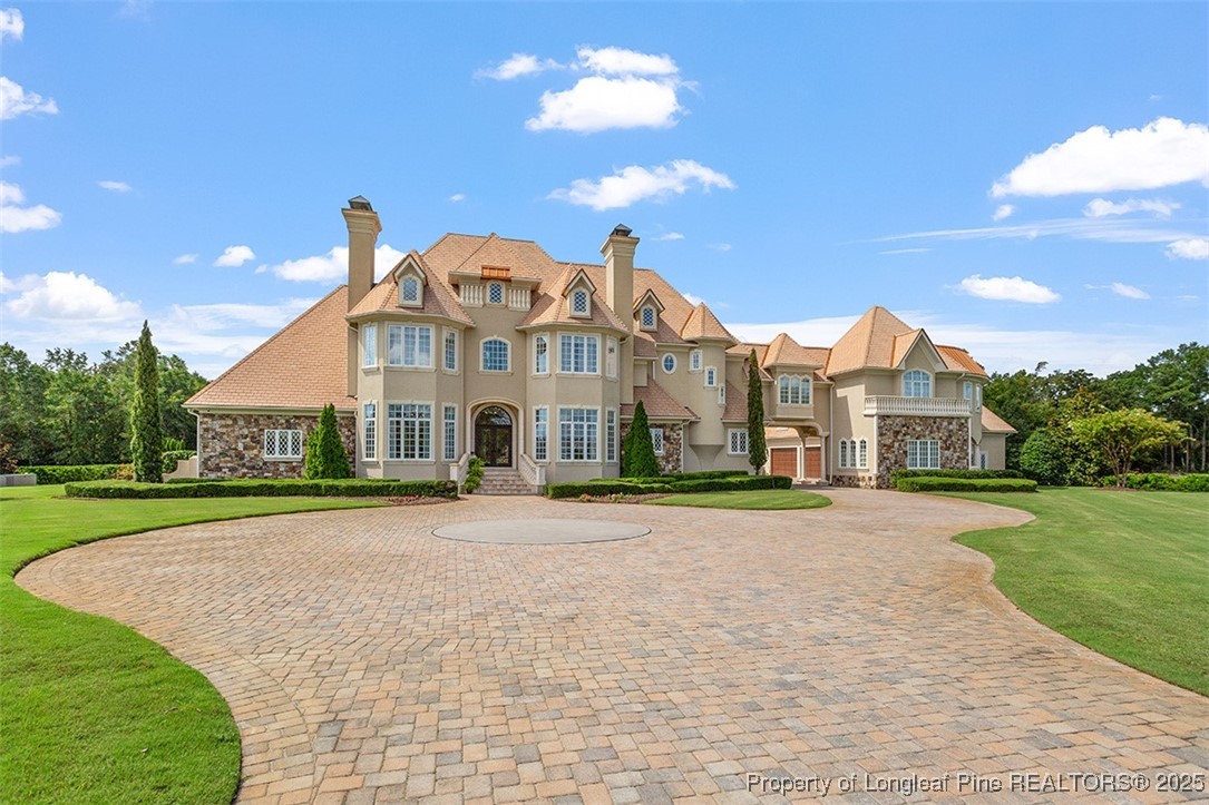 4909 Deep Branch Road Pembroke, NC 28372 - Photo 2 of 50 a front view of a house with a yard and trees