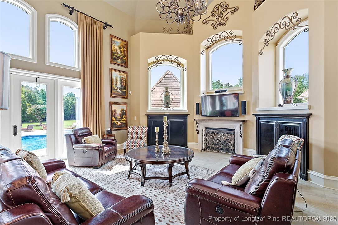 4909 Deep Branch Road Pembroke, NC 28372 - Photo 22 of 50 a living room with furniture fireplace and a large window
