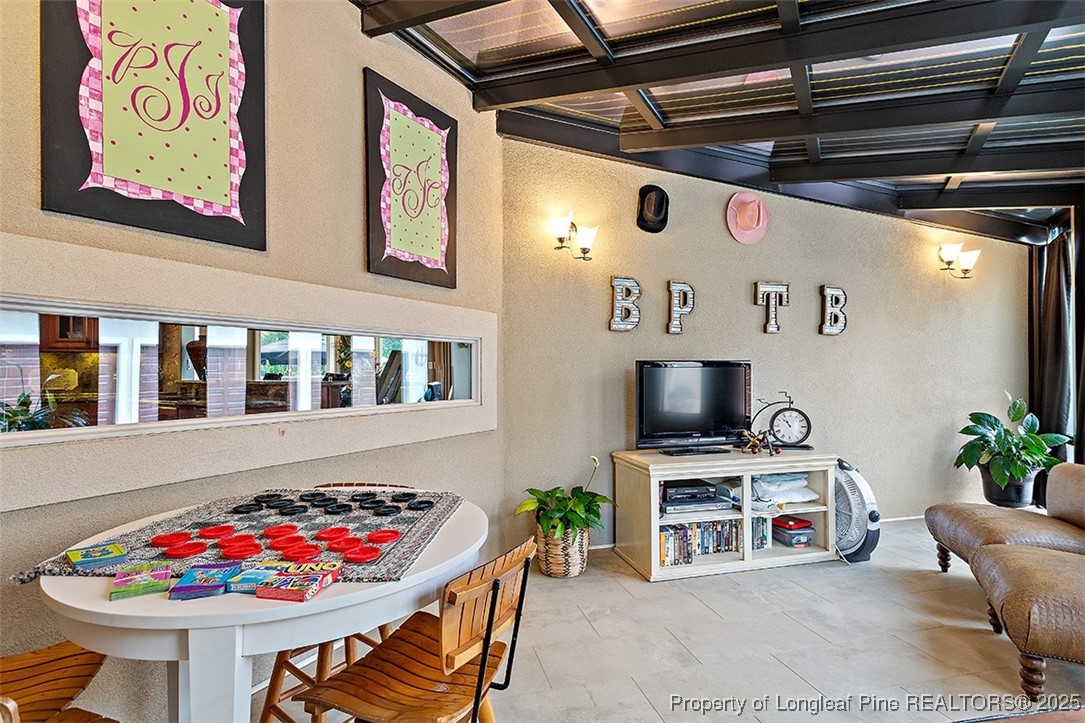 4909 Deep Branch Road Pembroke, NC 28372 - Photo 24 of 50 a living room with furniture and a flat screen tv