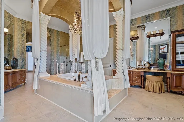 a bathroom with a tub a sink a mirror and a shower